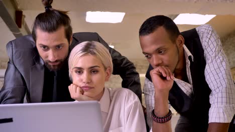 pretty businesswoman asks her colleagues their attitude to her ideas on laptop, business concept, communication concept