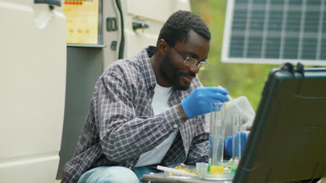 black man doing chemical tests