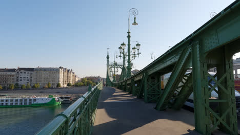 Walking-Across-the-Liberty-Bridge,-Budapest,-Hungary