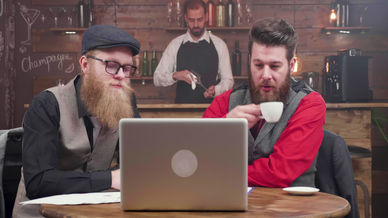 Men in business meeting at cafe