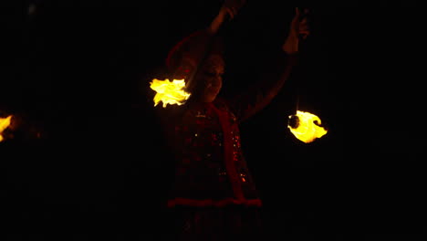 fire juggler in traditional costume