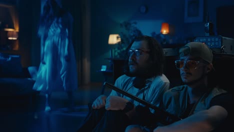 two men encountering a ghost in a dark room