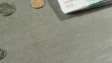 different currencies and coins on a surface