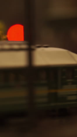 close-up of a miniature train with a red signal