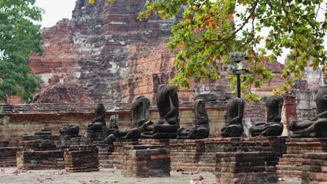 buddha statues amidst ancient brick ruins