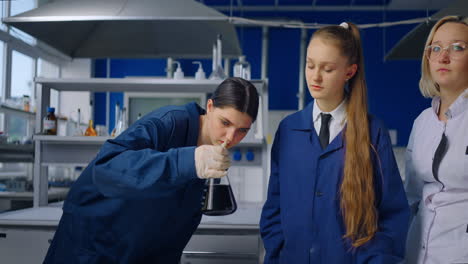 science students observing a chemical experiment