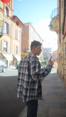 man walking through european city street