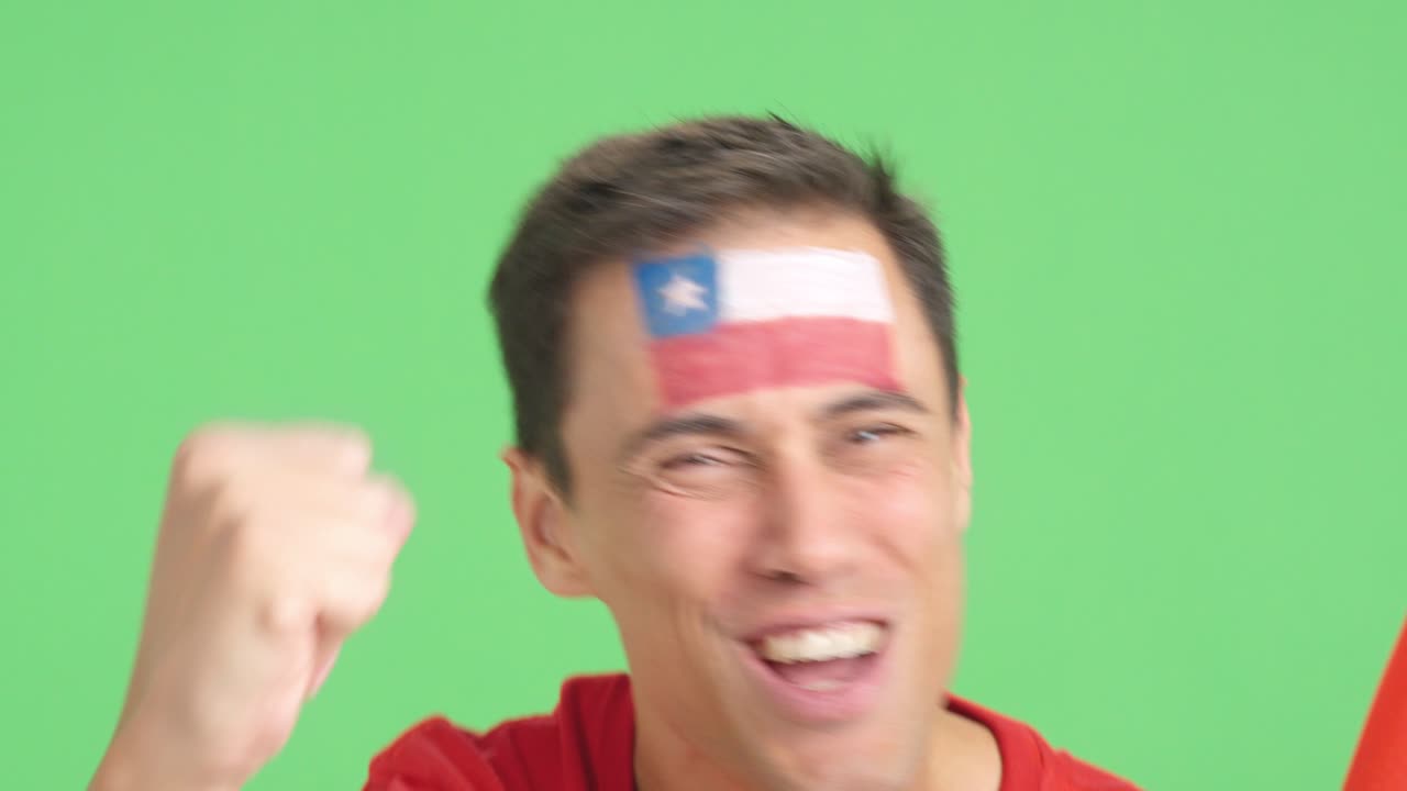 Close up of a man supporting chilean team