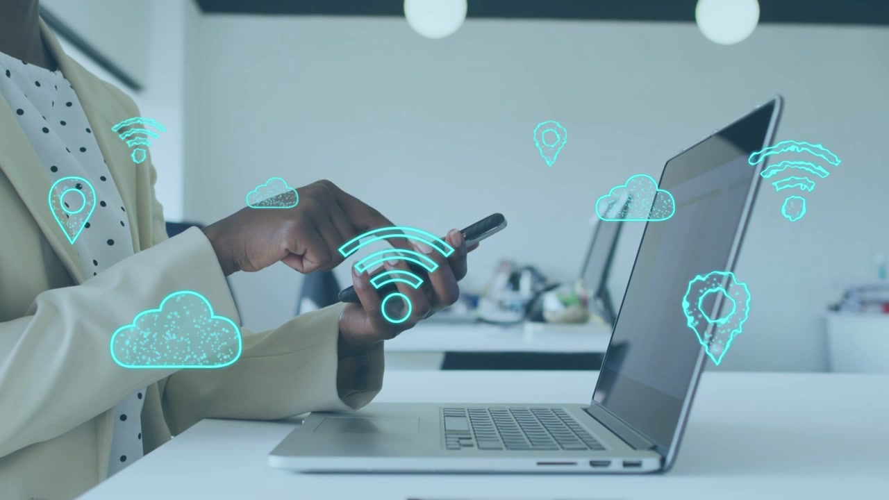 Businesswoman tapping smartphone over laptop causing Wi-Fi clouds pins popping forming tech network