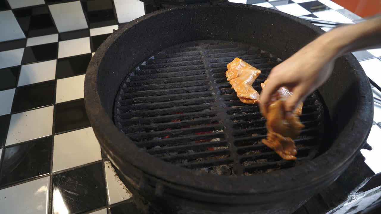 Preparation of delicious succulent meat steaks on the grill. Barbecue from charcoal.