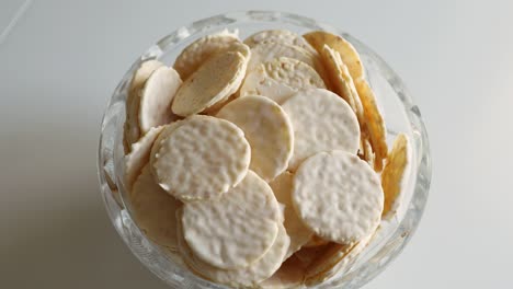 round cookies in white chocolate on a white table. sweet morning.