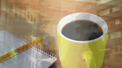 animación del paisaje urbano sobre notas y una taza de café