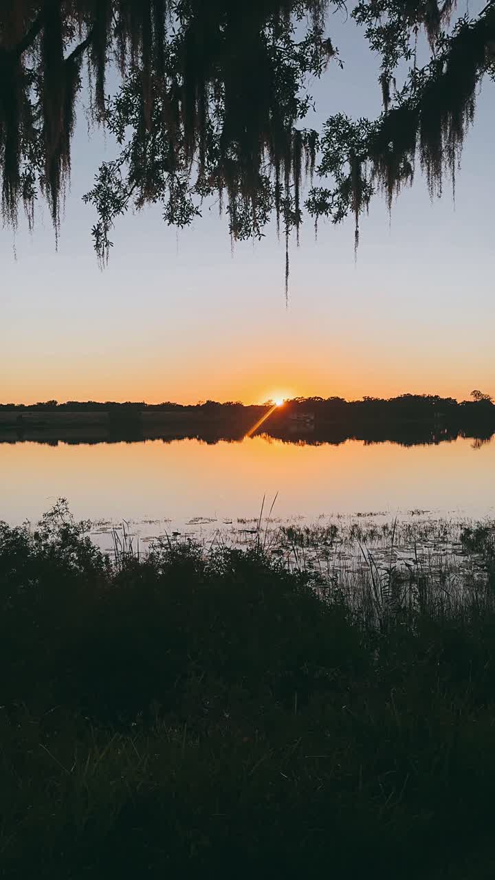 Sunrise or Sunset over a Calm Lake