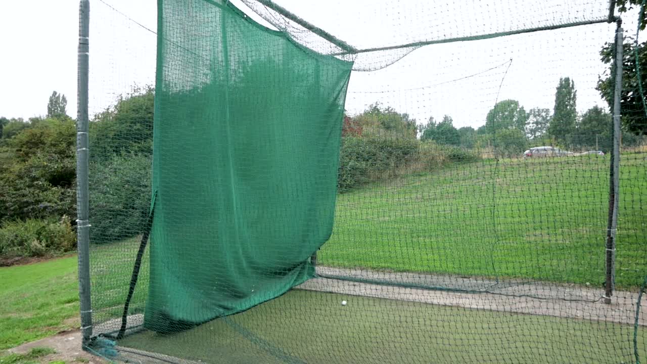 Slow motion shot of a player practicing in the net
