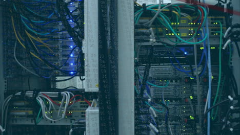 binary code animation over server racks with cables and blinking lights