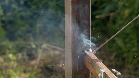 closeup-fixing-of-fence-part-with-welding-instrument