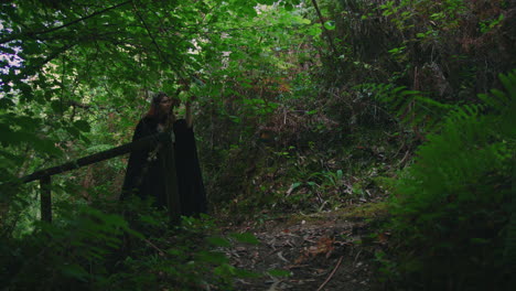 young-druid-girl-walking-in-a-forest-long-shot