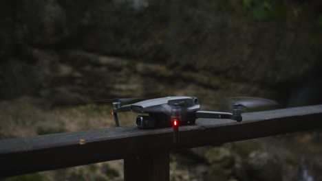 drone on a bridge over a waterfall