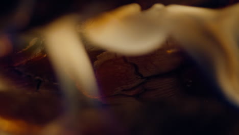 Slow-motion-shot-of-flames-and-embers-in-a-fireplace