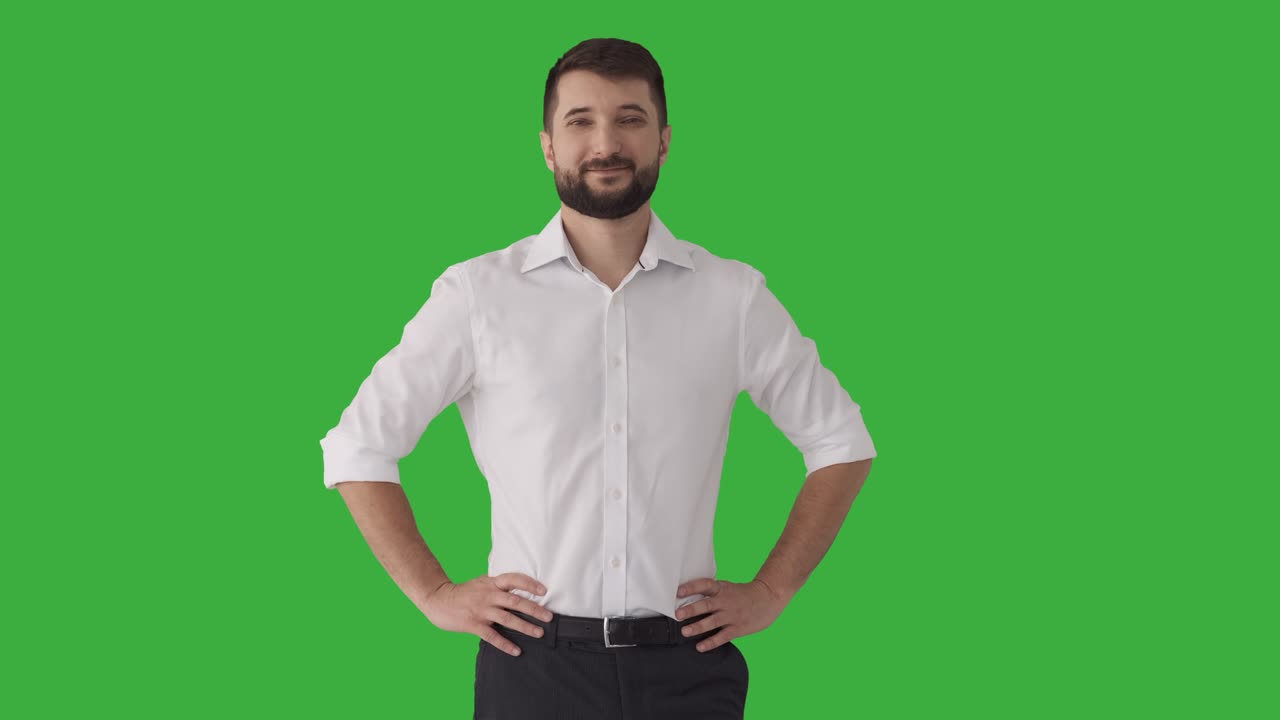 Confident businessman over green background