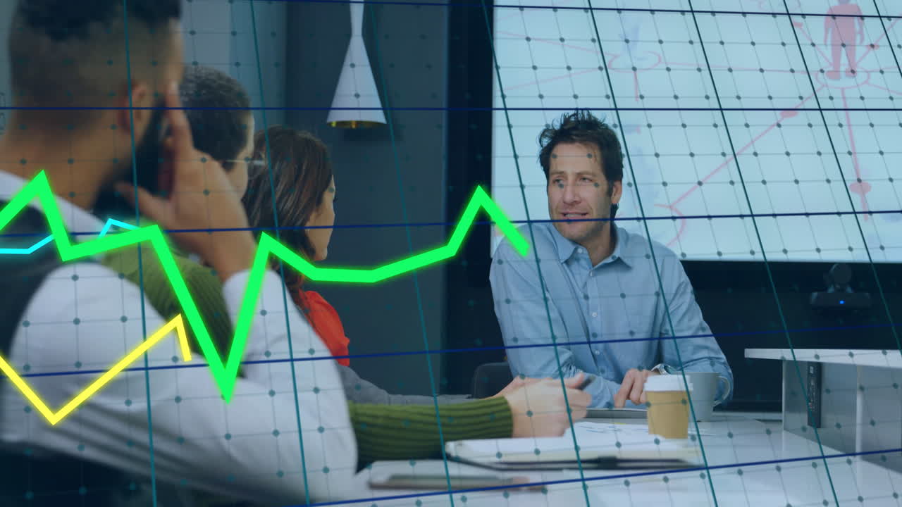 Business meeting with graph animation overlaying diverse team discussing strategy