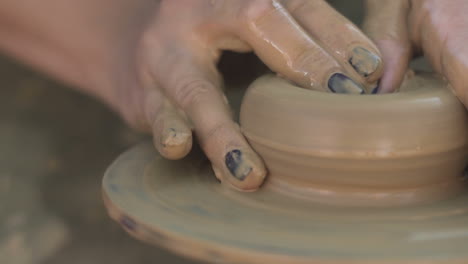 Hands-Of-Potter-Do-Pottery-On-A-Circle