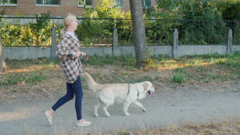 woman walking her dog outside