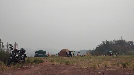 people go camping on the edge of the city on holidays