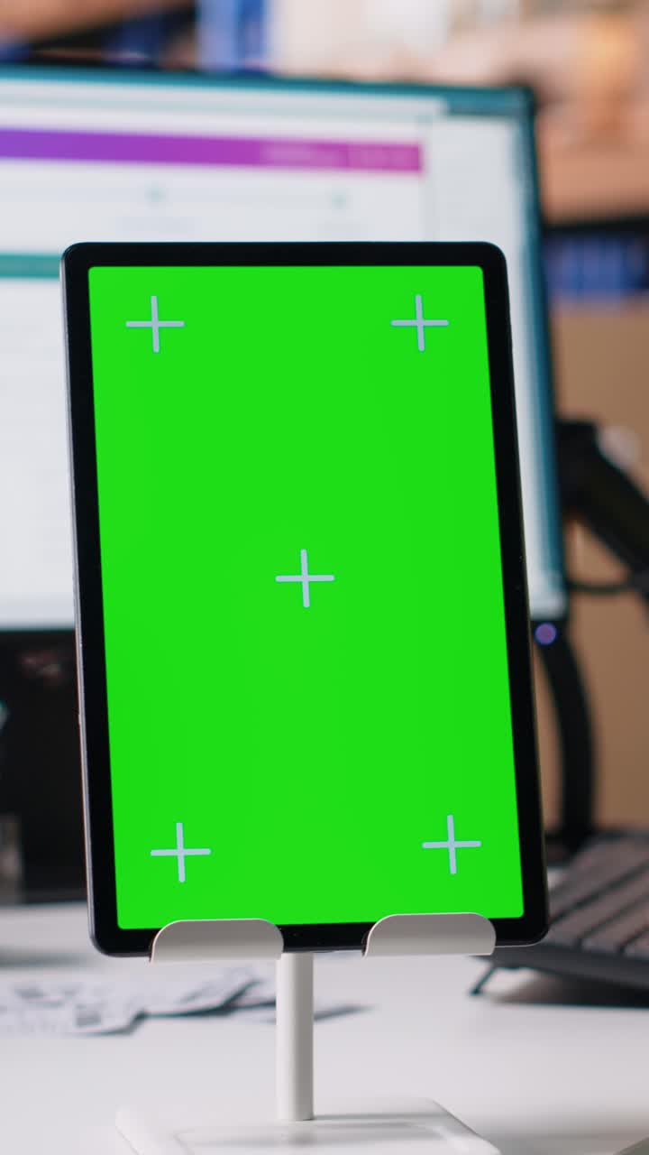 Vertical Video Employee reviews copy space monitor in the storage room for data entry