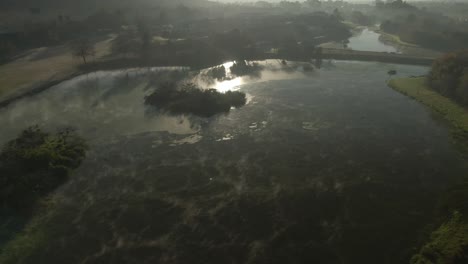 drone aerial mist on water rolling cold early morning