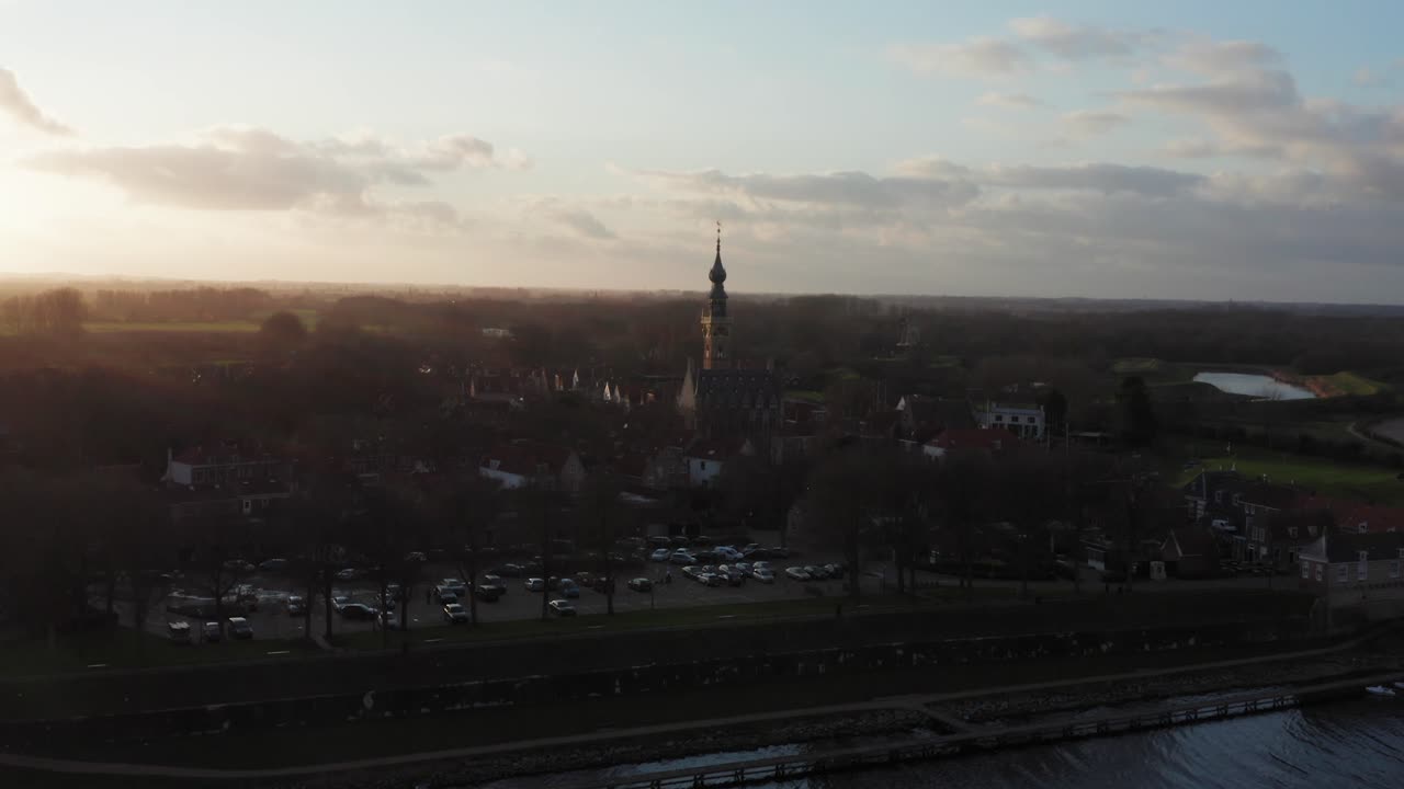 Aerial view of the historical village Veere located at a lake, during sunset