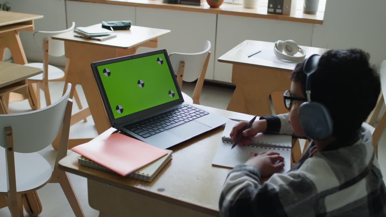 Student using a laptop in the classroom