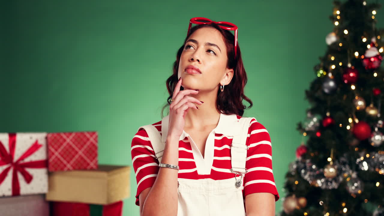 Woman with gifts and Christmas tree