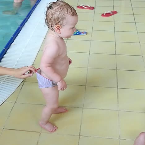 mother and baby girl having fun in the pool