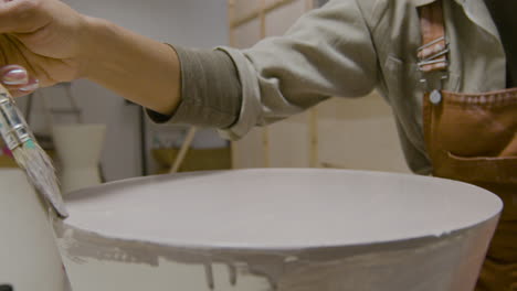 woman painting table