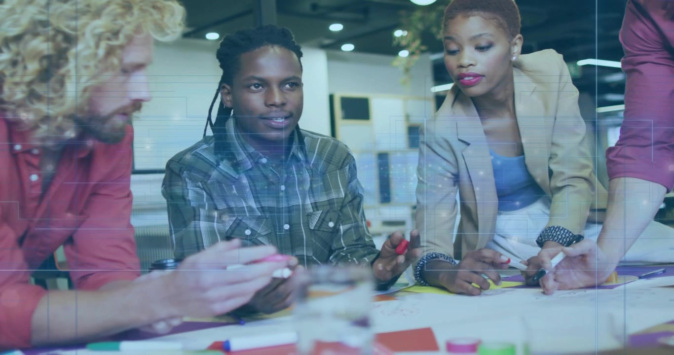 Diverse Creative Team Collaborating on Project in Modern Office