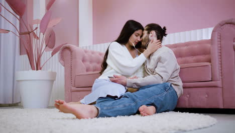 young people kissing on the carpet