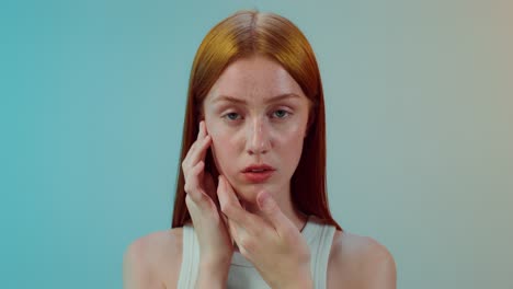 portrait of a young woman with red hair and freckles