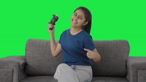 Competitive-Indian-teenage-girl-wins-the-video-game-match-Green-screen