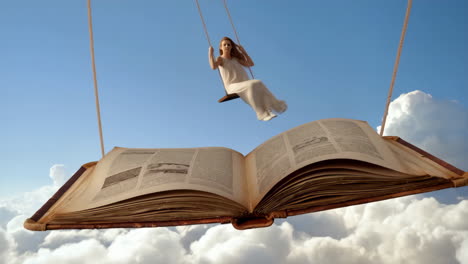 dreamlike fantasy: woman on a swing on a giant flying book above the clouds