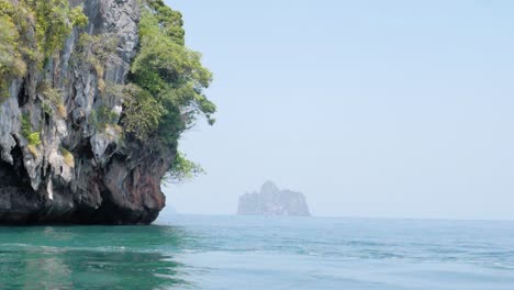 ultra slow motion shot of limestone cliffs in water in thailand
