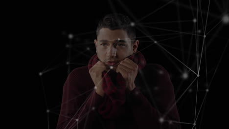 animation of a biracial man wearing a scarf with white connection icons floating in foreground