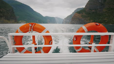 cruise ship cruise with two lifebuoys in the background the picturesque norwegian fjord 4k video