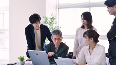 business persons working in an office