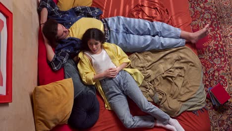 teenagers relaxing on a bed