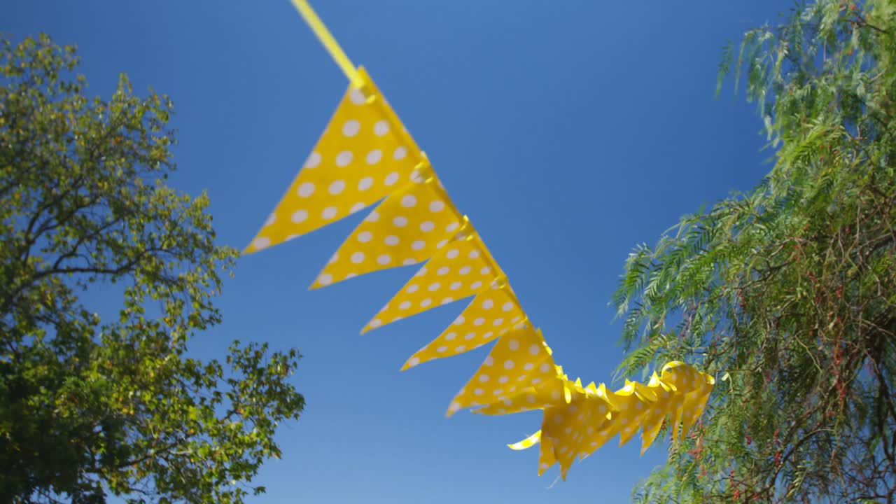 Bunting waving against blue sky 4k