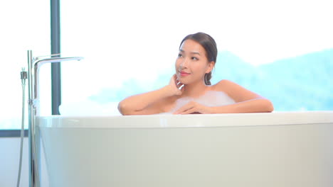 beautiful asian woman in white bathtub, spa center, beauty and makeup concept