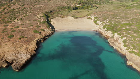 Aerial-View-Of-Calamosche-Beach-During-Summer-In-Italy---drone-shot