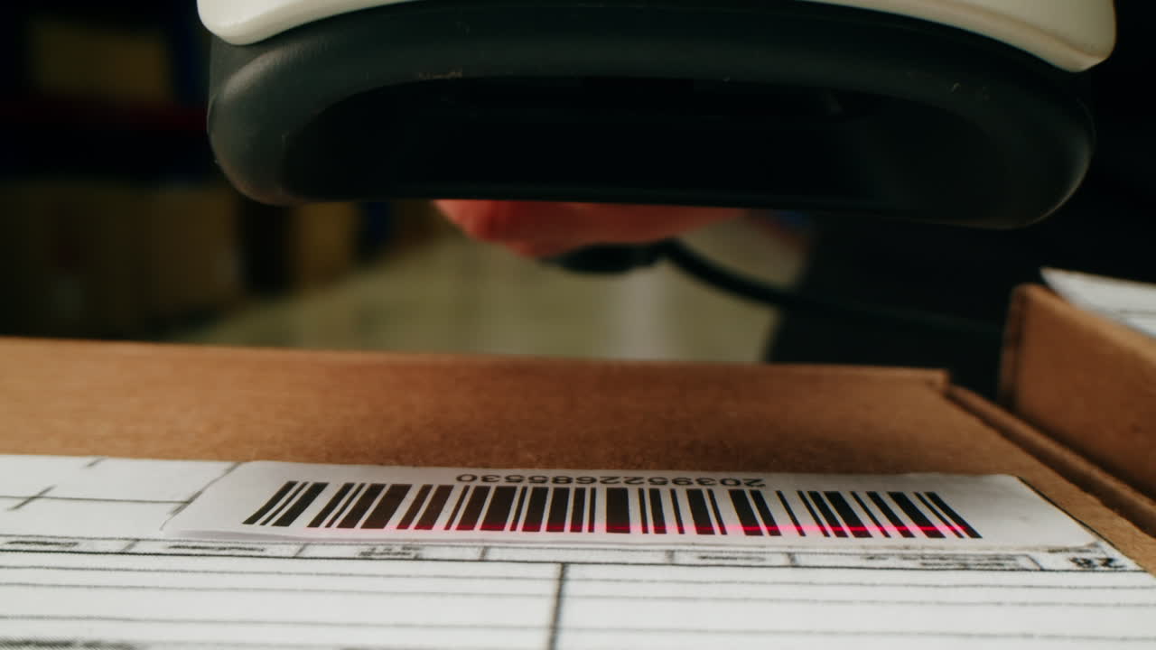 Scanner scan delivery box in storage, E-commerce shop, man packing goods and clothes second hand delivery market, courier Packaging and Shipping Workspace with Supplies and Technology, online sales.