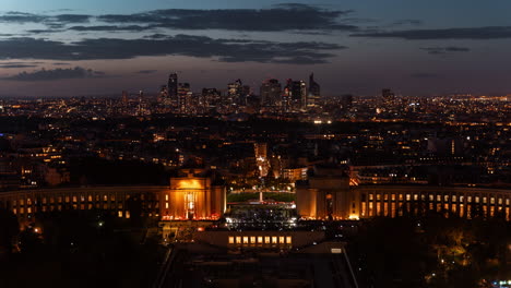 paris skyline at night with illuminated buildings